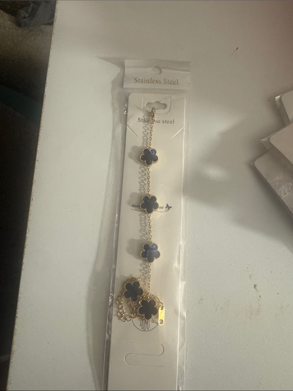 Gold Bracelet with Navy Blue Clover Charms